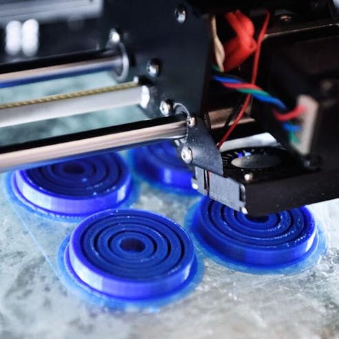 Blue 3D printed parts. Image Credit: Shutterstock.com/Sergey Privalov